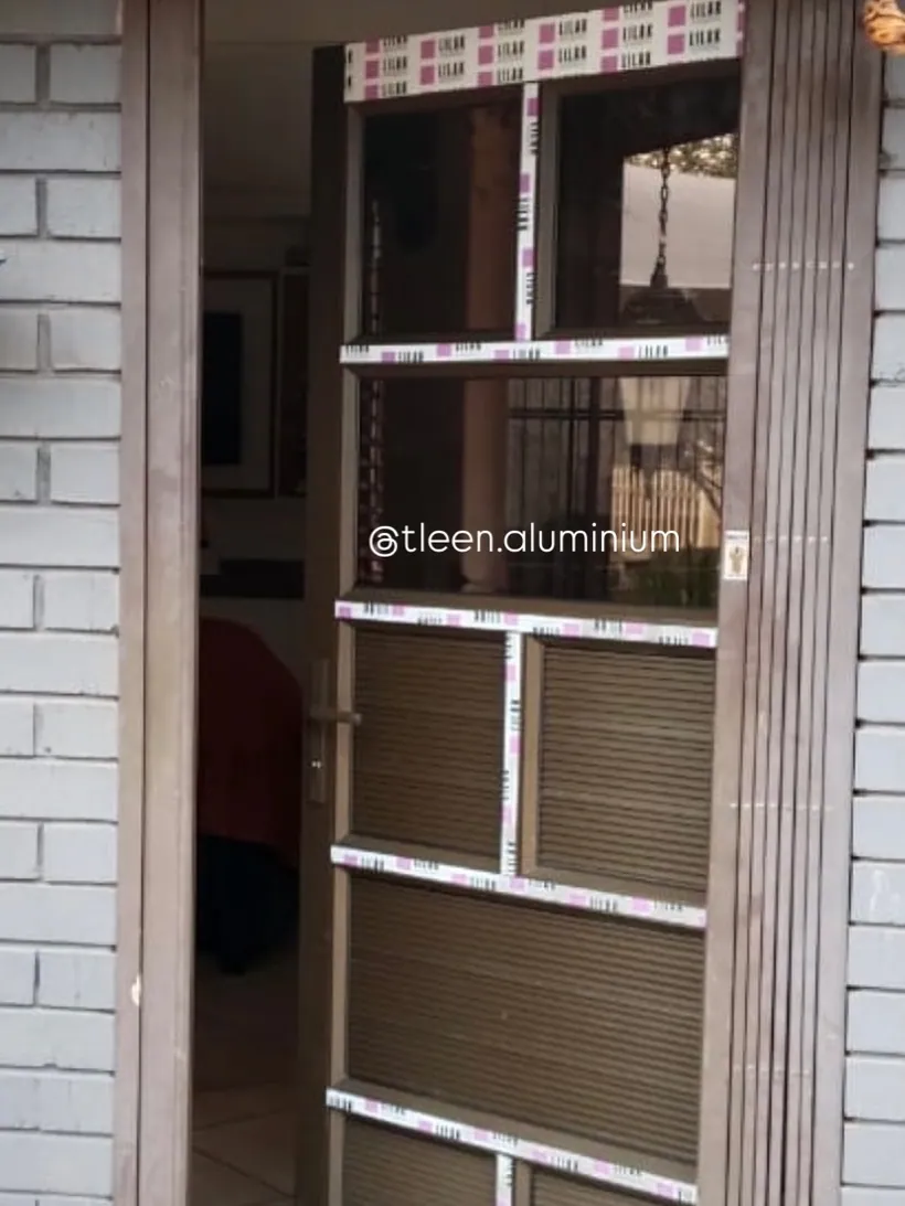 Security gate fitted to an internal doorway
